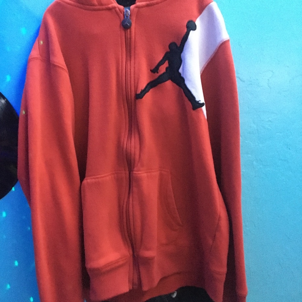 Jordan small red zip up jacket with black logo and logo on zipper